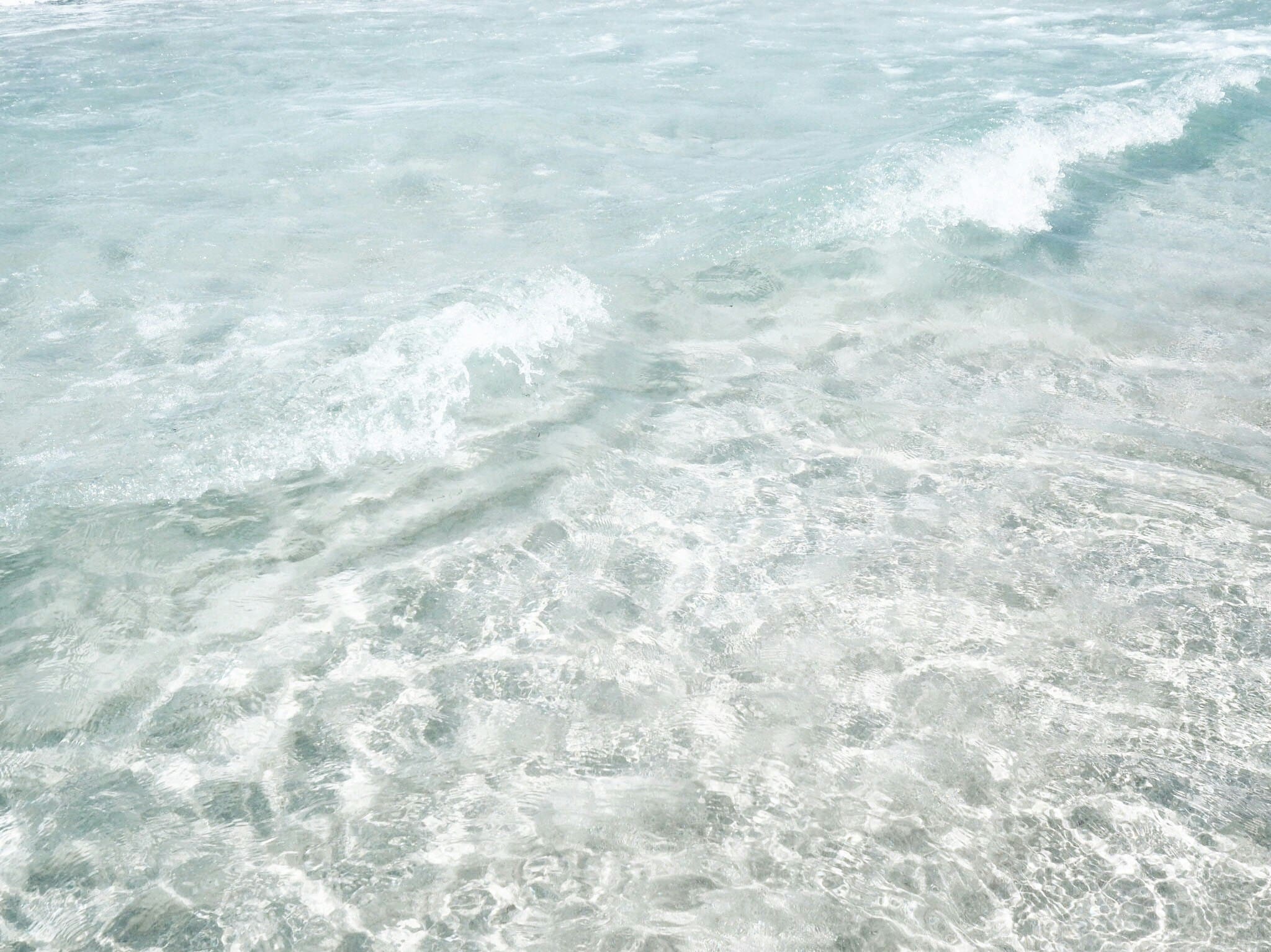 crystal clear light blue water, glittering from the sun